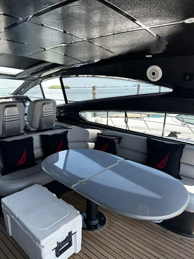 Lupo Yacht Photos Pics Luxurious 2009 Pershing 56 yacht interior with sleek seating and modern table design.