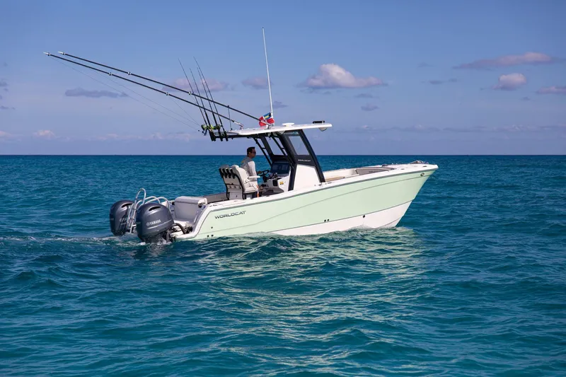  Yacht Photos Pics 2026 World Cat 265 CC-X boat cruising on clear blue ocean waters.