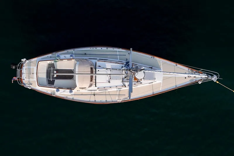 Loon Yacht Photos Pics Aerial view of 1988 Hinckley Sou'wester 42 sailboat on dark water.