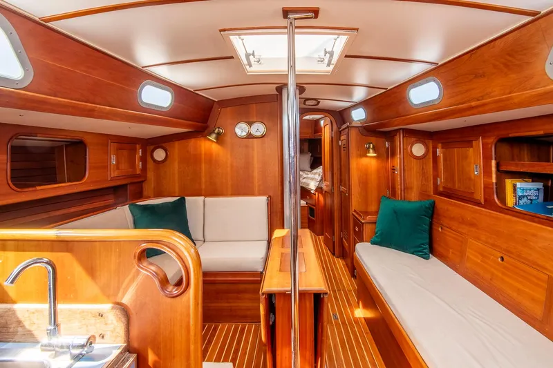 Loon Yacht Photos Pics Interior of 1988 Hinckley Sou'wester 42 sailboat with wooden finish and cozy seating.