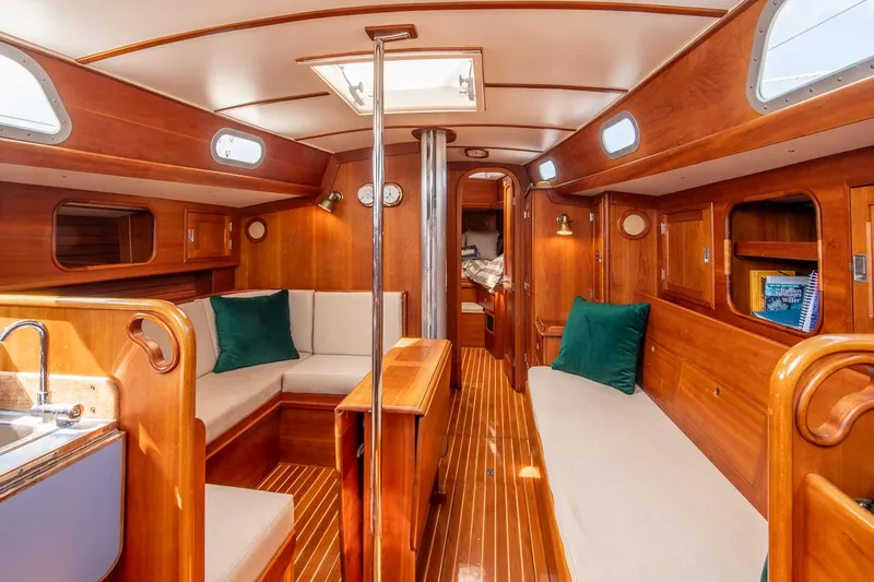 Loon Yacht Photos Pics Interior of 1988 Hinckley Sou'wester 42 sailboat with wooden finish and cozy seating.