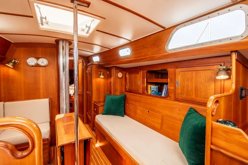 Loon Yacht Photos Pics Interior of 1988 Hinckley Sou'wester 42 sailboat with wooden furnishings and cozy seating.