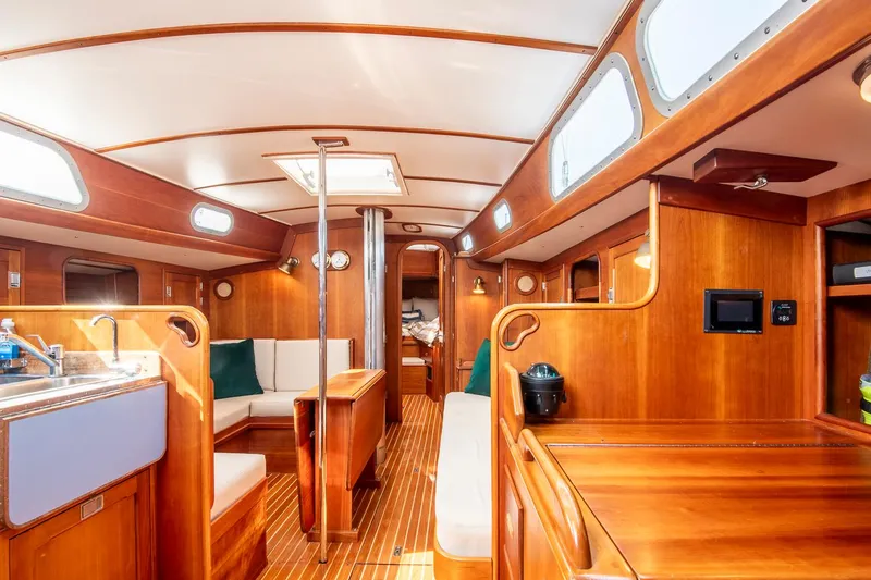 Loon Yacht Photos Pics Interior of 1988 Hinckley Sou'wester 42 sailboat, featuring elegant woodwork and spacious layout.