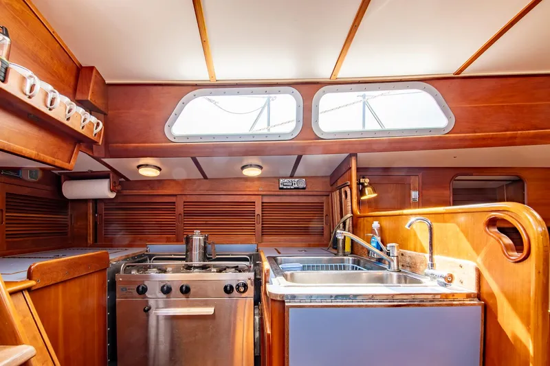 Loon Yacht Photos Pics Interior of 1988 Hinckley Sou'wester 42 yacht kitchen with stove and sink.
