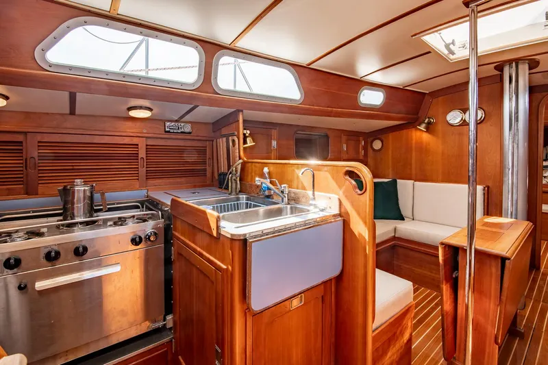 Loon Yacht Photos Pics Interior of 1988 Hinckley Sou'wester 42 sailboat with kitchen and seating area.