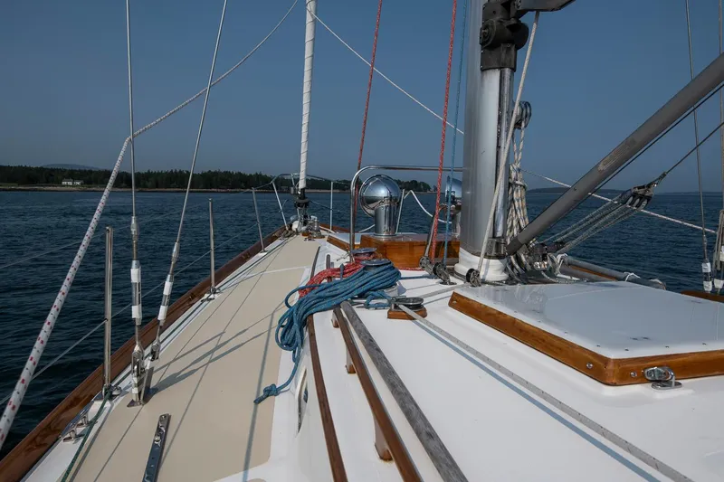 Loon Yacht Photos Pics Sailing on a 1988 Hinckley Sou'wester 42 yacht, calm waters, clear sky.