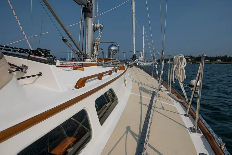 Loon Yacht Photos Pics 1988 Hinckley Sou'wester 42 sailboat deck with ropes and clear sky.