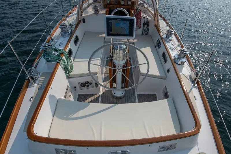 Loon Yacht Photos Pics Cockpit of 1988 Hinckley Sou'wester 42 sailboat with steering wheel and navigation system.