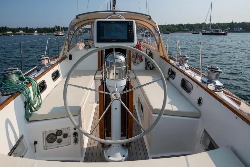 Loon Yacht Photos Pics Cockpit of 1988 Hinckley Sou'wester 42 sailboat with steering wheel and navigation equipment.