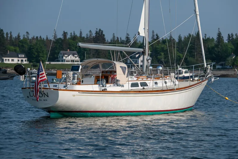 Loon Yacht Photos Pics 1988 Hinckley Sou'wester 42 sailboat anchored in scenic coastal waters.