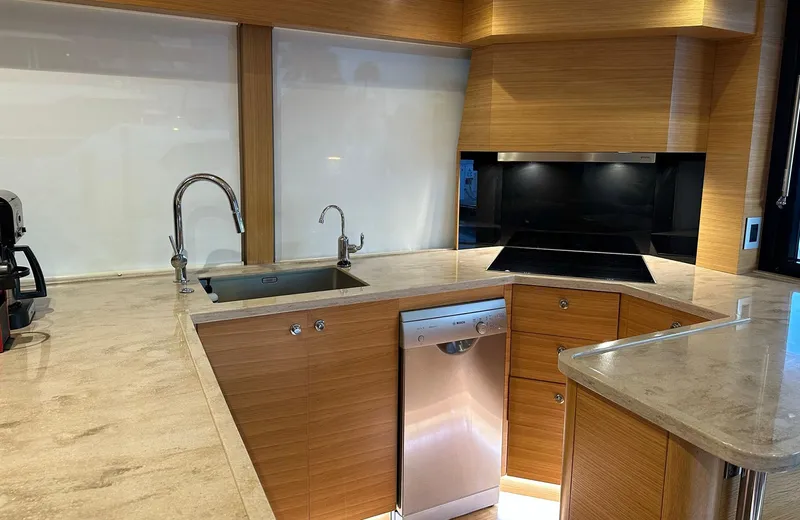 Oasis Yacht Photos Pics Modern kitchen in 2021 Outer Reef Trident 620 yacht with sleek countertops and stainless steel appliances.