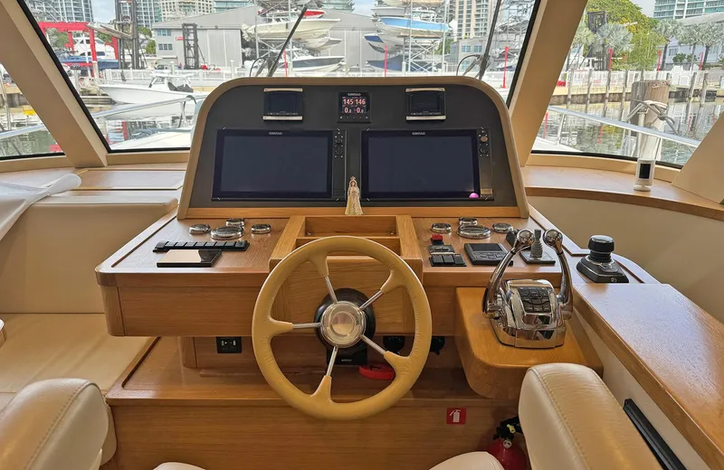 Oasis Yacht Photos Pics Helm of 2021 Outer Reef Trident 620 yacht with modern navigation equipment.