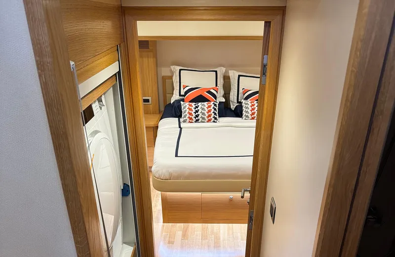 Oasis Yacht Photos Pics Luxurious bedroom interior of 2021 Outer Reef Trident 620 yacht with modern bedding.