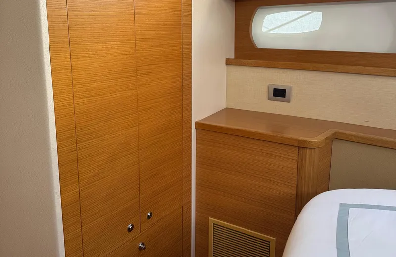 Oasis Yacht Photos Pics Luxurious wooden interior of 2021 Outer Reef Trident 620 yacht cabin.