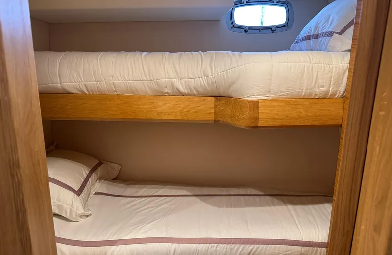 Oasis Yacht Photos Pics Bunk beds in 2021 Outer Reef Trident 620 yacht cabin with window.