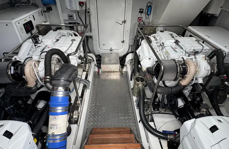 Oasis Yacht Photos Pics Engine room of 2021 Outer Reef Trident 620 yacht, featuring dual engines and mechanical systems.