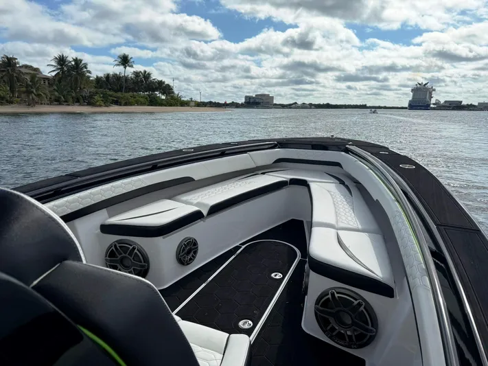  Yacht Photos Pics 2024 Statement 350 Open boat interior with sleek seating on a sunny day.