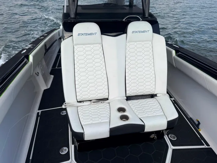  Yacht Photos Pics 2024 Statement 350 Open boat with white cushioned seats on deck.