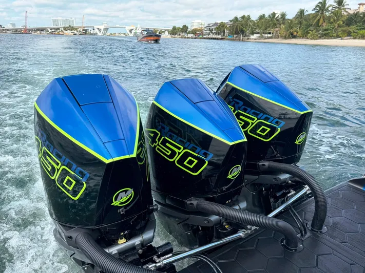  Yacht Photos Pics Triple Mercury 450R outboard engines on a 2024 Statement 350 Open boat, cruising on water.