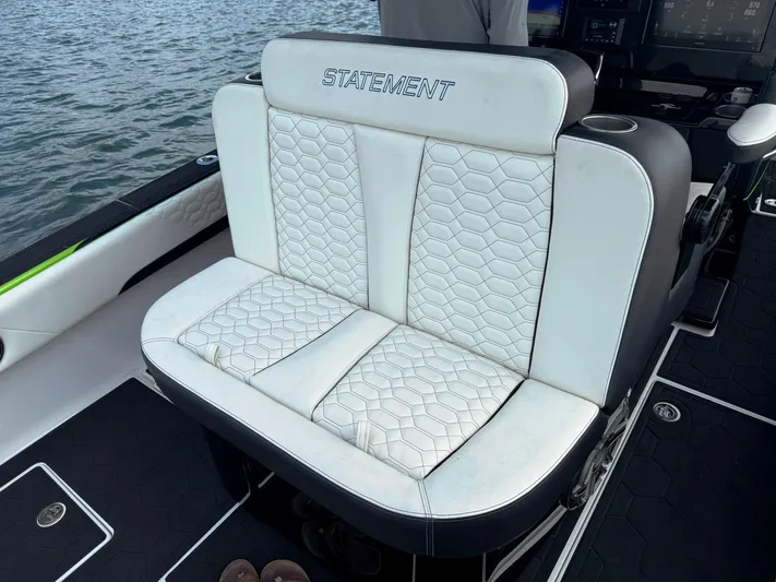  Yacht Photos Pics 2024 Statement 350 Open boat seat with white quilted upholstery.