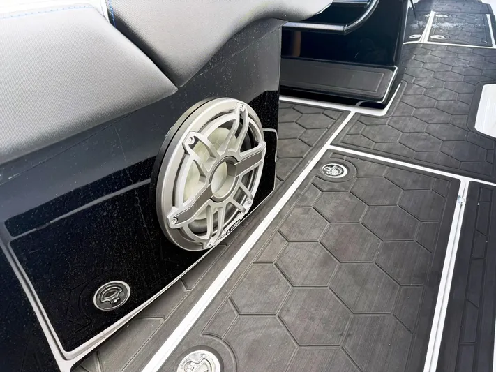  Yacht Photos Pics 2024 Statement 350 Open boat interior with speaker and hexagonal flooring design.