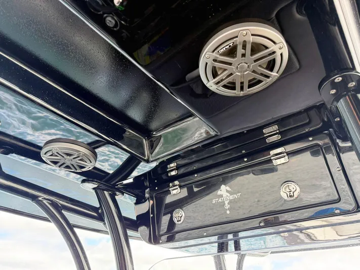  Yacht Photos Pics 2024 Statement 350 Open boat interior with speakers and storage compartments.