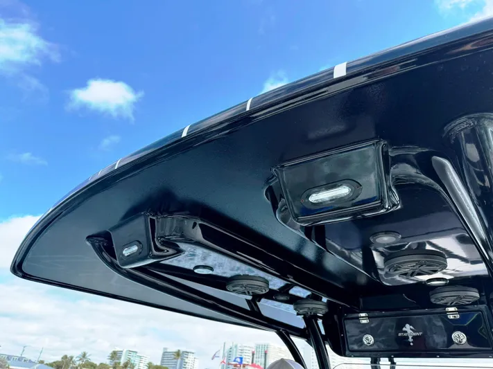  Yacht Photos Pics 2024 Statement 350 Open boat canopy with integrated lights, under a clear blue sky.