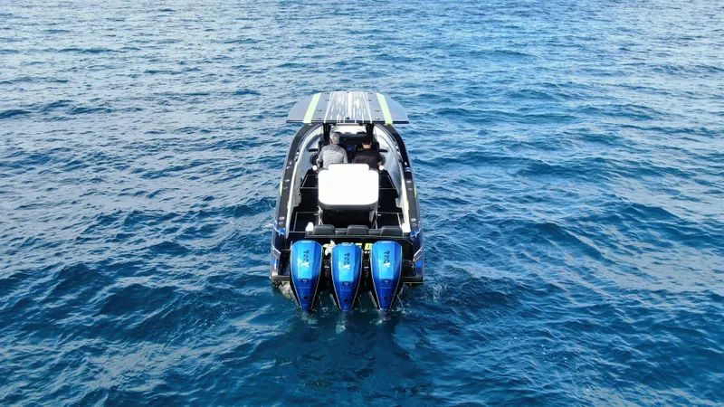 Yacht Photos Pics 2024 Statement 350 Open boat with triple engines on open sea.