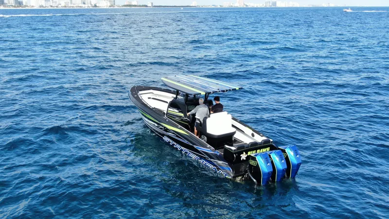  Yacht Photos Pics 2024 Statement 350 Open boat cruising on blue ocean waters.