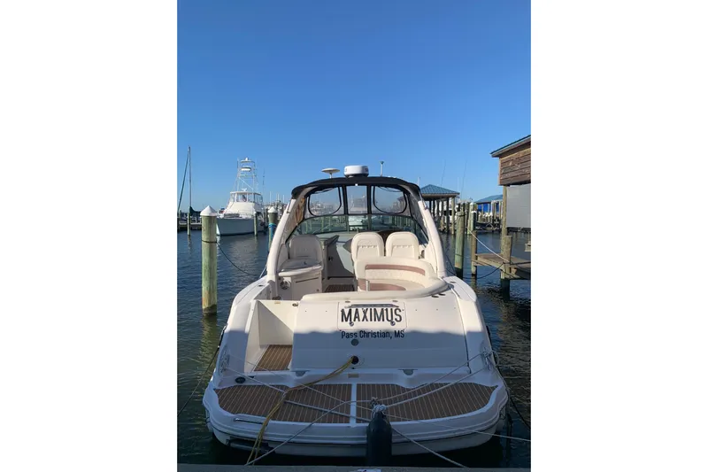 Maximus Yacht Photos Pics 2005 Sea Ray 340 Sundancer docked at marina, clear blue sky.