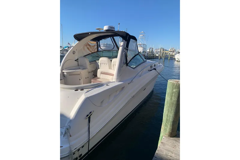 Maximus Yacht Photos Pics 2005 Sea Ray 340 Sundancer yacht docked at marina under clear blue sky.