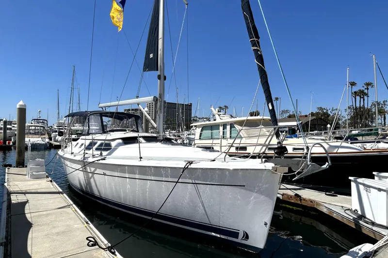 Island Myst II Yacht Photos Pics 2007 Hunter 41 Deck Salon sailboat docked in a marina under clear blue skies.