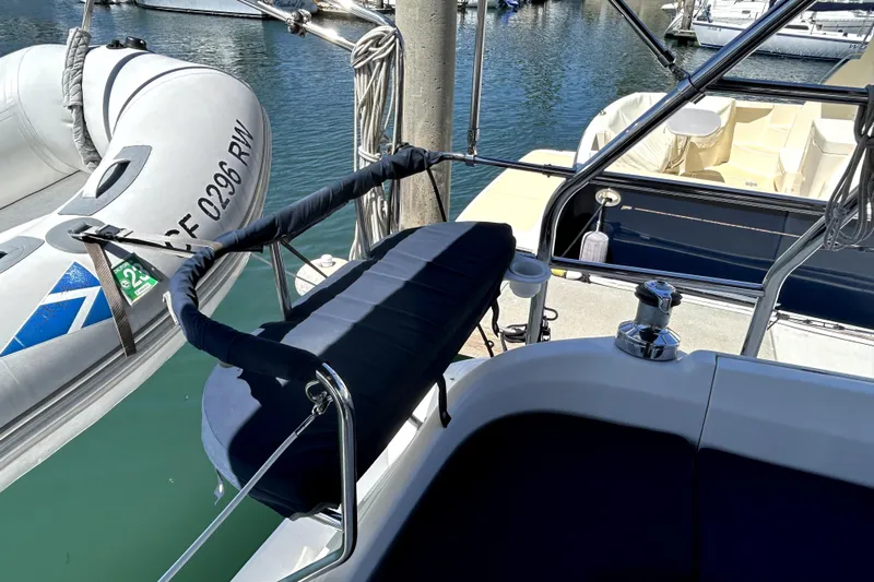 Island Myst II Yacht Photos Pics 2007 Hunter 41 Deck Salon yacht with inflatable dinghy docked at marina.