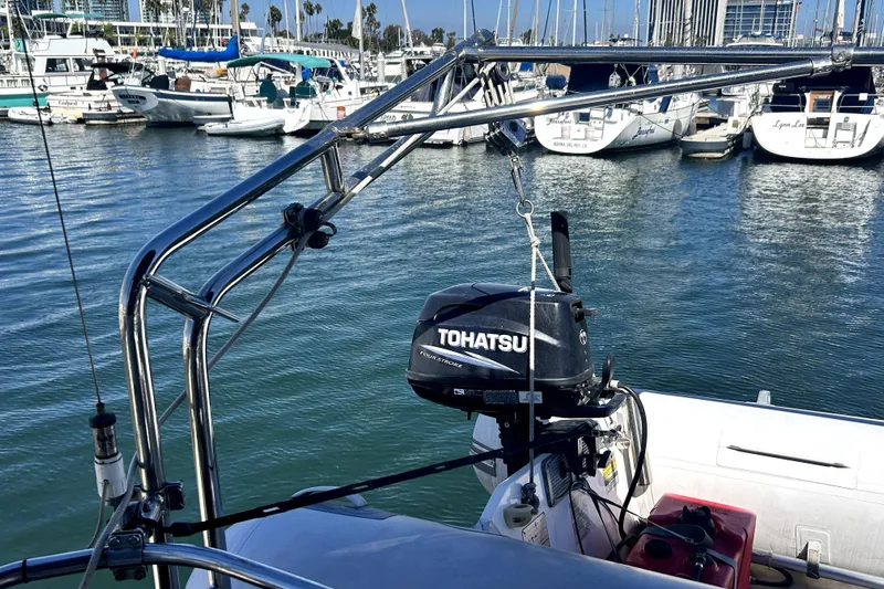 Island Myst II Yacht Photos Pics 2007 Hunter 41 Deck Salon with Tohatsu outboard motor in marina setting.