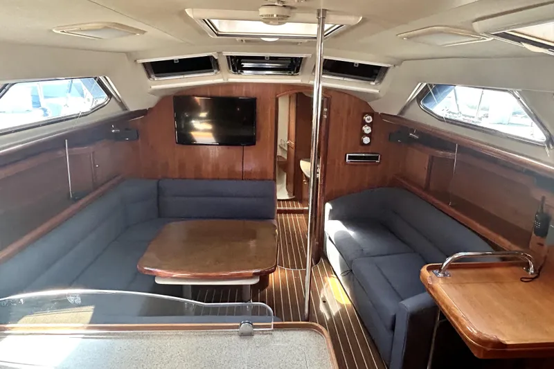Island Myst II Yacht Photos Pics Interior of 2007 Hunter 41 Deck Salon yacht with cozy seating and wooden finishes.