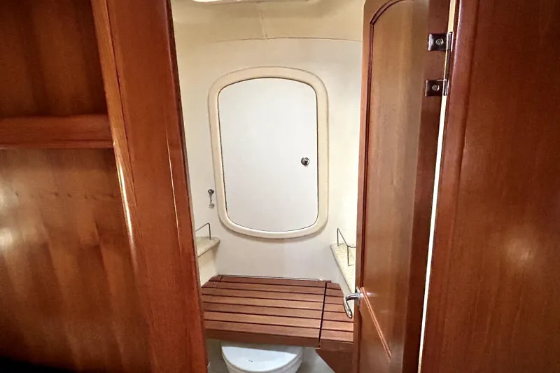 Island Myst II Yacht Photos Pics Interior of 2007 Hunter 41 Deck Salon yacht bathroom with wooden accents.