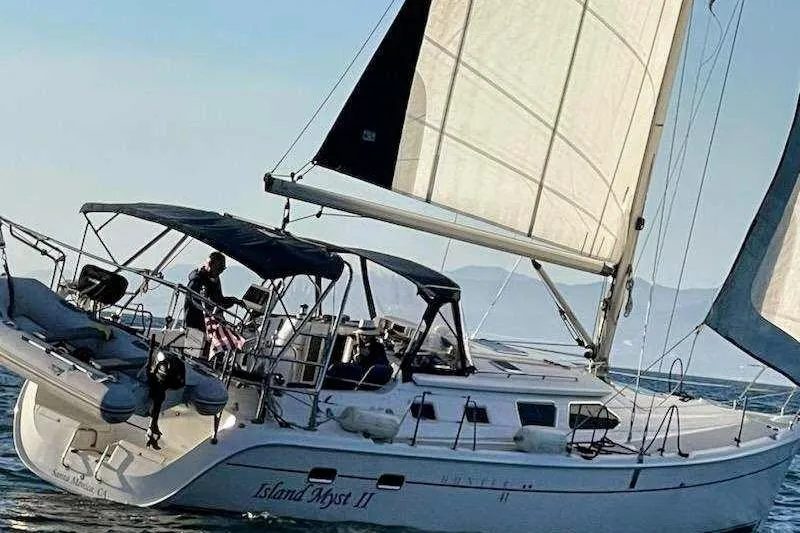 Island Myst II Yacht Photos Pics 2007 Hunter 41 Deck Salon sailboat with sails up on open water.