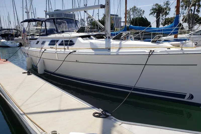 Island Myst II Yacht Photos Pics 2007 Hunter 41 Deck Salon yacht docked at marina, side view.