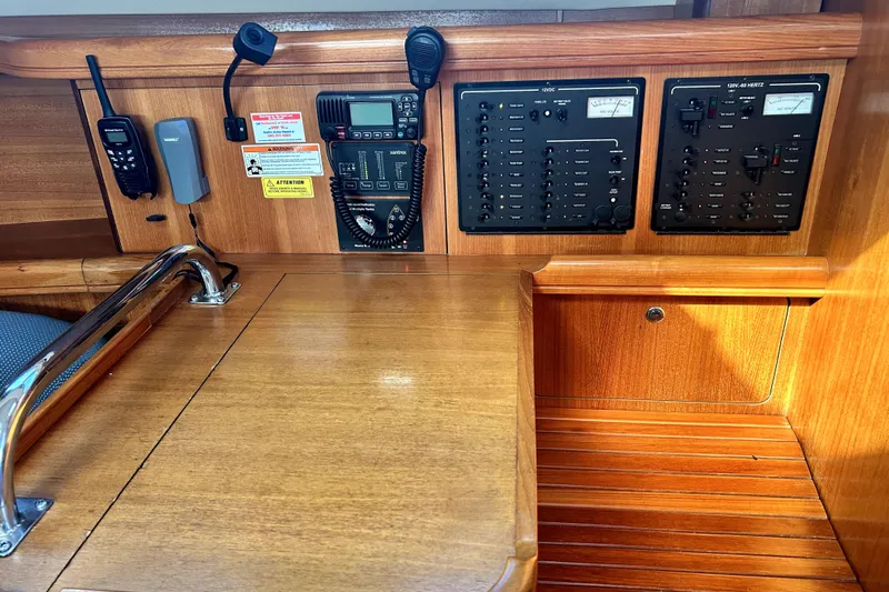 Island Myst II Yacht Photos Pics Control panel of 2007 Hunter 41 Deck Salon sailboat with communication devices.