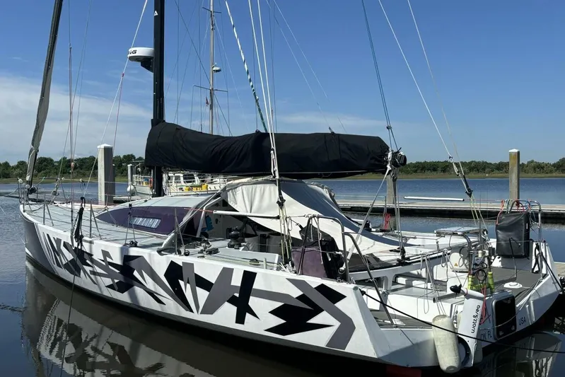 Zed4 Yacht Photos Pics Sleek 2009 Akilaria RC2 Class 40 sailboat docked, featuring bold geometric design.