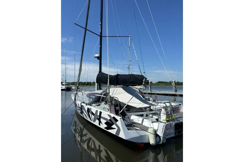 Zed4 Yacht Photos Pics 2009 Class 40 Akilaria RC2 sailboat docked, featuring sleek design and modern rigging.