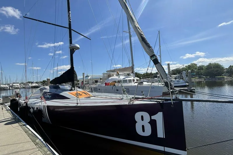 Zed4 Yacht Photos Pics Sailboat Class 40 Akilaria RC2, 2009 model, docked in a sunny marina.