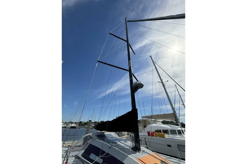Zed4 Yacht Photos Pics Sailboat Akilaria RC2 Class 40, 2009 model, docked under a clear blue sky.