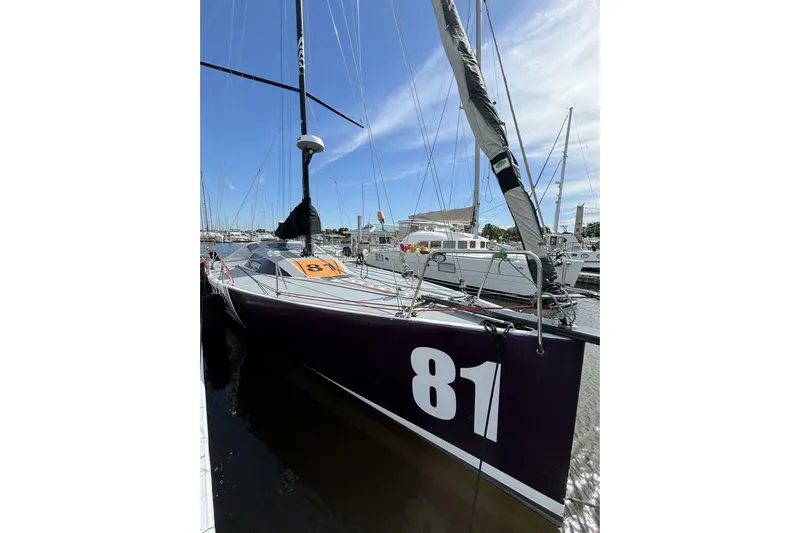 Zed4 Yacht Photos Pics Sailboat Akilaria RC2 Class 40, 2009 model, docked with number 81 displayed.