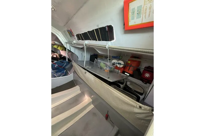 Zed4 Yacht Photos Pics Interior of 2009 Class 40 Akilaria RC2 sailboat with organized storage and safety equipment.