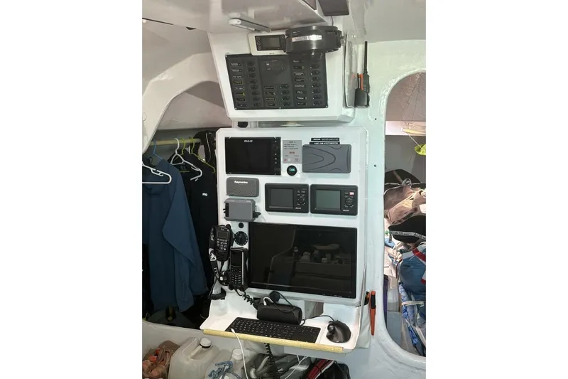 Zed4 Yacht Photos Pics Navigation equipment inside 2009 Class 40 Akilaria RC2 yacht, featuring control panels and communication devices.