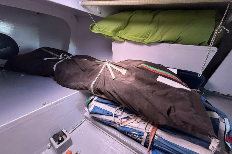 Zed4 Yacht Photos Pics Interior of 2009 Class 40 Akilaria RC2 sailboat with stored sails and gear.