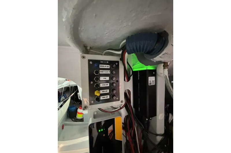 Zed4 Yacht Photos Pics Control panel inside 2009 Class 40 Akilaria RC2 yacht, featuring switches and wiring.