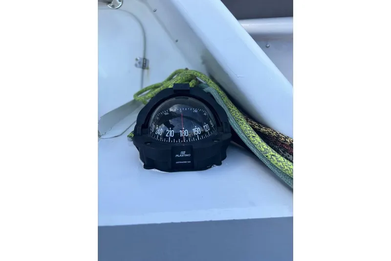 Zed4 Yacht Photos Pics Compass on Akilaria RC2 Class 40 yacht, 2009 model, with green rope nearby.