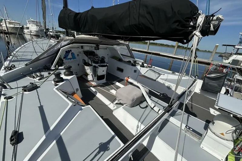Zed4 Yacht Photos Pics 2009 Akilaria RC2 Class 40 sailboat cockpit, docked at marina under clear blue sky.
